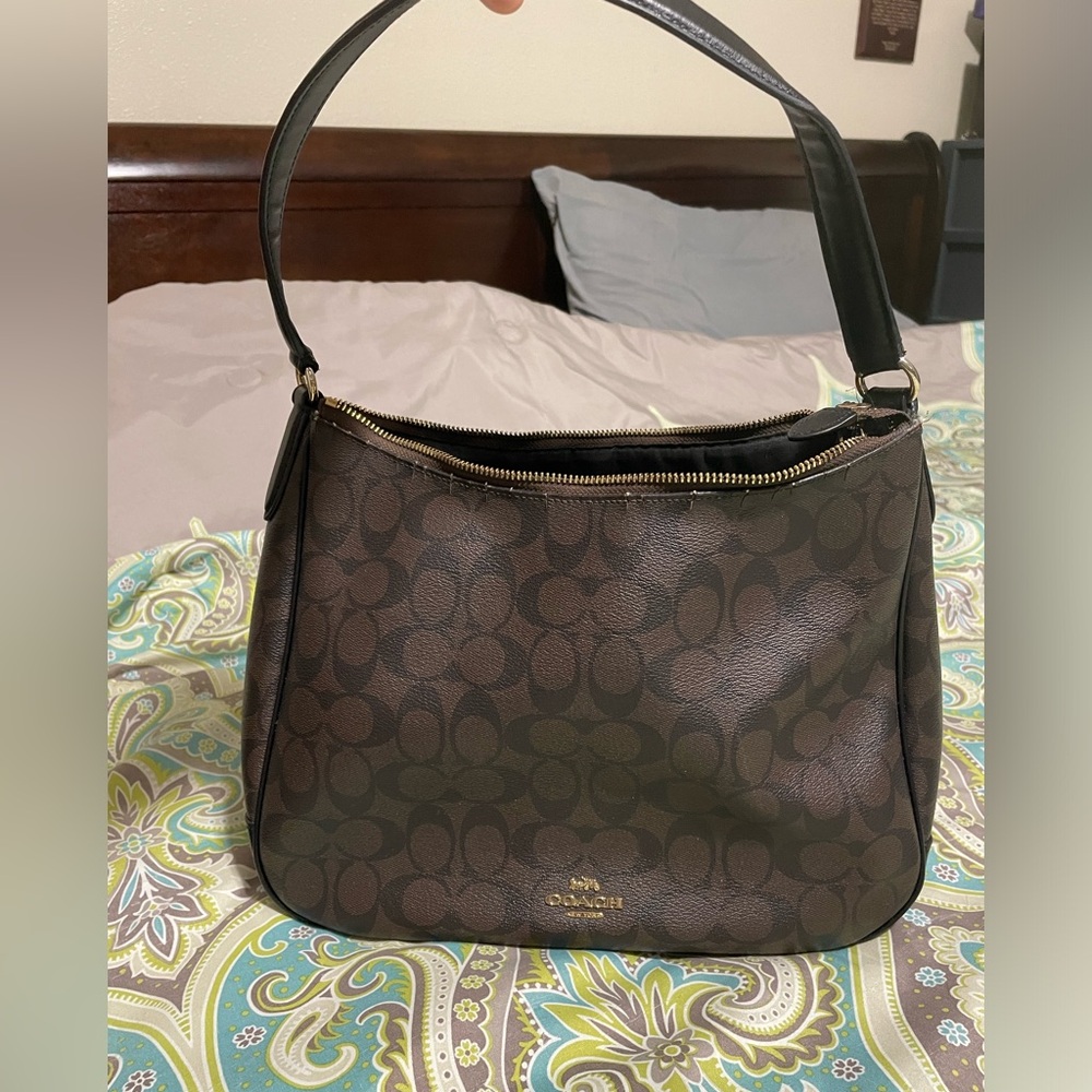 Coach Handbag in good condition. Roomy and nice in signature coach detail